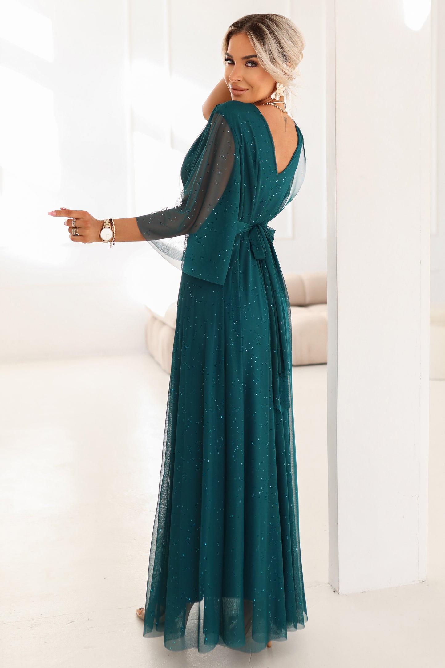 654-1 Long, shimmering plus-size dress with a scoop neckline and sheer sleeves - bottle green