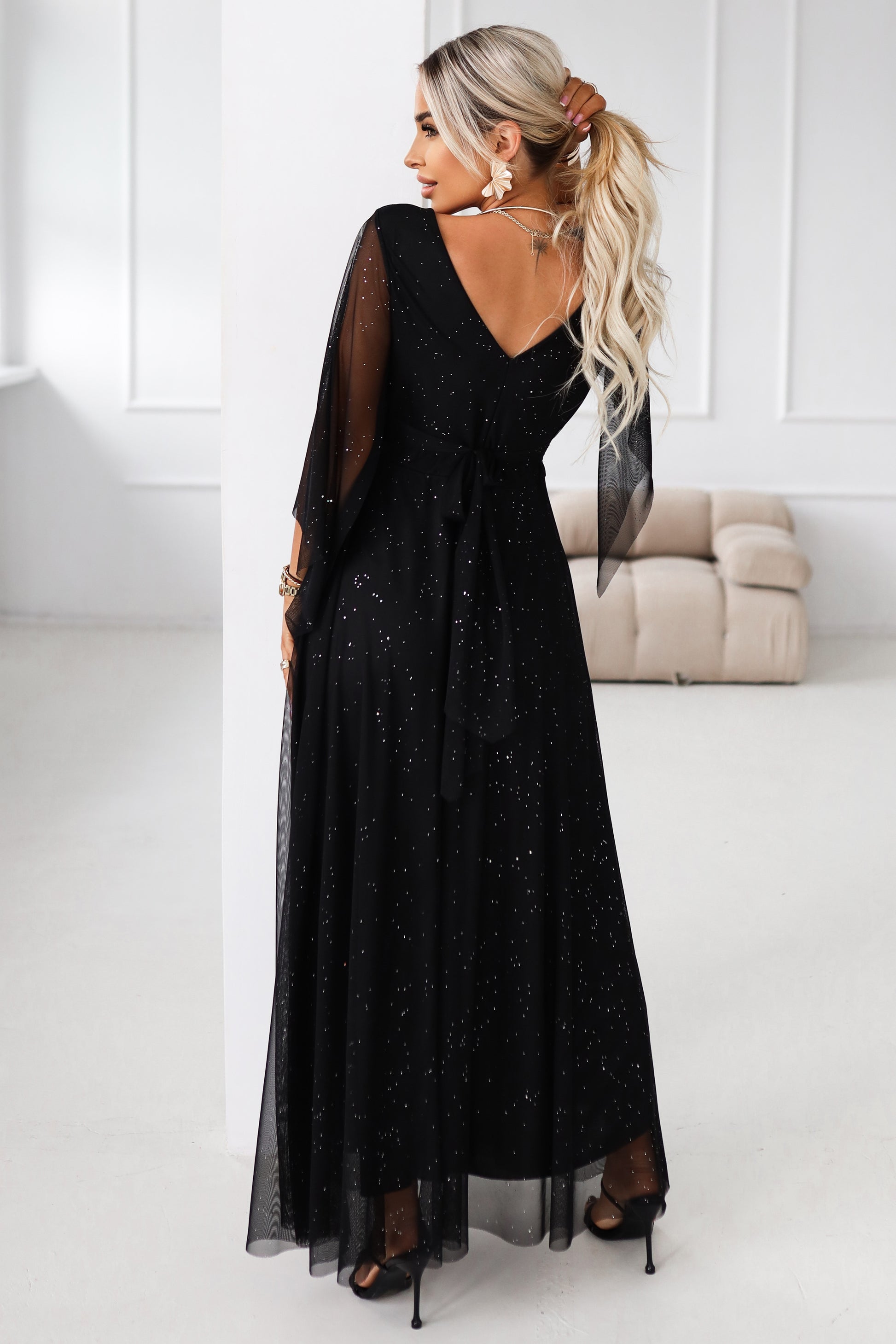 655-1 Long, shimmering dress with a neckline and transparent sleeves - black