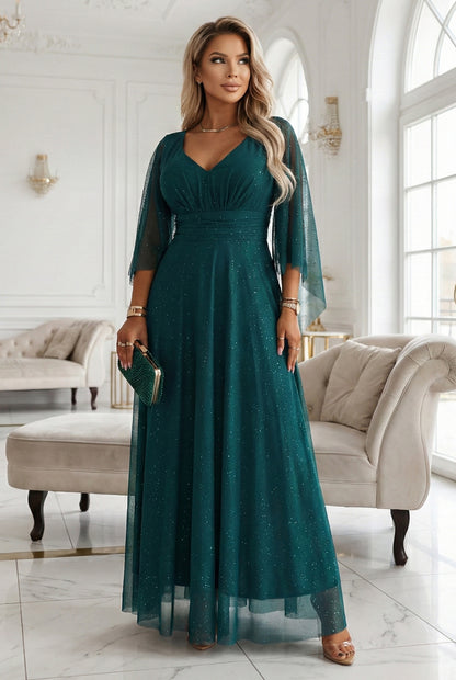 655-2 A long, shimmering dress with a plunging neckline and sheer sleeves - emerald green