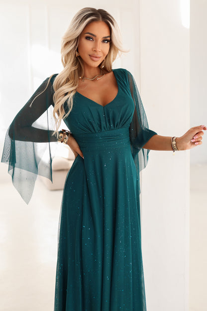 655-2 A long, shimmering dress with a plunging neckline and sheer sleeves - emerald green